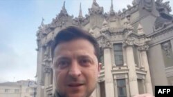 President of Ukraine Volodymyr Zelenskyy shows himself speaking to a camera in Ukraine after a Russian attack, and vowing to stay and fight on, Feb. 26, 2022, in this screen grab taken from a video made available on his Facebook account.