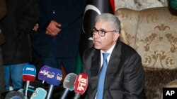 FILE - Fathi Bashagha holds a news conference after east-based lawmakers named Bashagha to replace then Prime Minister Abdul Hamid Dbeibah as head of a new interim government, in Tripoli, Libya, Feb. 10, 2022. 