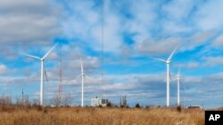 Land-based windmills in Atlantic City, N.J., help power a sewage treatment plant, taken Feb. 18, 2022. The second day of the largest-ever auction of offshore wind energy sites in the U.S. was held Feb. 24, with strong interest from companies wanting to bu