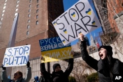 Demonstrators supporting Ukraine gather outside the United Nations during an emergency meeting of the U.N. General Assembly, Feb. 28, 2022, in New York.