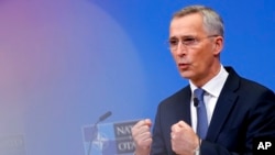 FILE - NATO Secretary-General Jens Stoltenberg speaks during a news conference after convening an online NATO leaders summit at NATO headquarters in Brussels, Feb. 25, 2022.