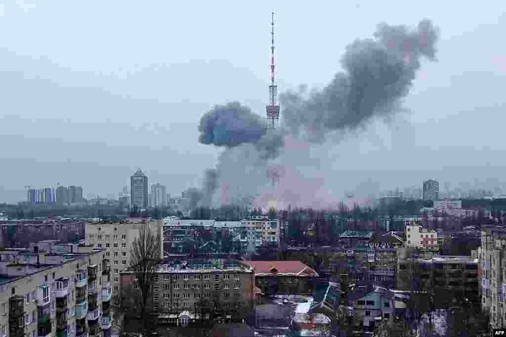 This handout picture released on the Facebook page of the Ukrainian Interior Ministry, March 1, 2022 show the smoke after a missile attack targeting the Ukrainian capital&#39;s television center in Kyiv. (Ukrainian Interior Ministry Press Service/AFP) 