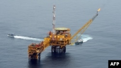 FILE - An aerial view of Total oil platform at Amenem, 35 kilometers away from Port Harcourt in the Niger Delta, Apr. 14, 2009.