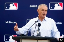 Major League Baseball Commissioner Rob Manfred speaks during a news conference after negotiations with the players' association toward a labor deal, at Roger Dean Stadium in Jupiter, Fla., March 1, 2022.