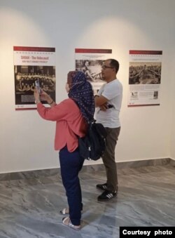 Visitors to the Holocaust Museum in Minahasa, North Sulawesi, seem to take some pictures of information posters on display inside the museum which was inaugurated in January 2022. (Photo: Courtesy of Yaakov Baruch)