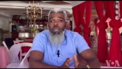 Yon Lidè Politik Ayisyen di Etazini ak Larisi Dwe Evite Tout Derapaj