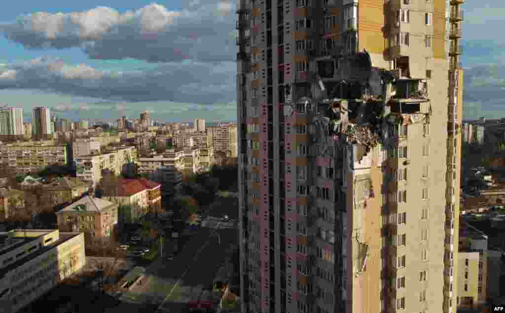 This general view shows damage to the upper floors of a building in Kyiv, Ukraine, Feb. 26, 2022, after it was reportedly struck by a Russian rocket.