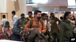 FILE - A batch of 250 Indian nationals stranded in Ukraine arrived from Bucharest at Chhatrapati Shivaji Maharaj International Airport in Mumbai, India, Saturday, Feb. 26, 2022. (Rajanish Kakade/AP)