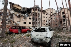 A view shows a residential building destroyed by recent shelling in the city of Irpin in the Kyiv region, Ukraine, as Russia's invasion of Ukraine continues, March 2, 2022.
