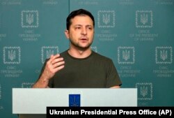 Ukrainian President Volodymyr Zelenskyy speaks to the nation in Kyiv, Feb. 27, 2022