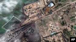 This satellite image provided by Maxar Technologies shows ground forces equipment and convoy in Khilchikha, Belarus Monday, Feb. 28, 2022.
