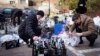 Members of civil defense prepare Molotov cocktails in a yard in Kyiv, Ukraine, Feb. 27, 2022.