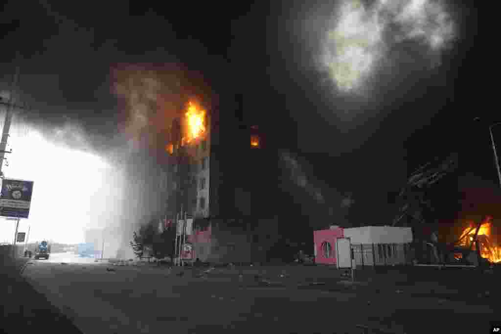 A building burns after shelling in Kyiv, Ukraine, March 3, 2022.&nbsp;Russia has launched a wide-ranging&nbsp;attack on Ukraine, hitting cities and bases with airstrikes or shelling.