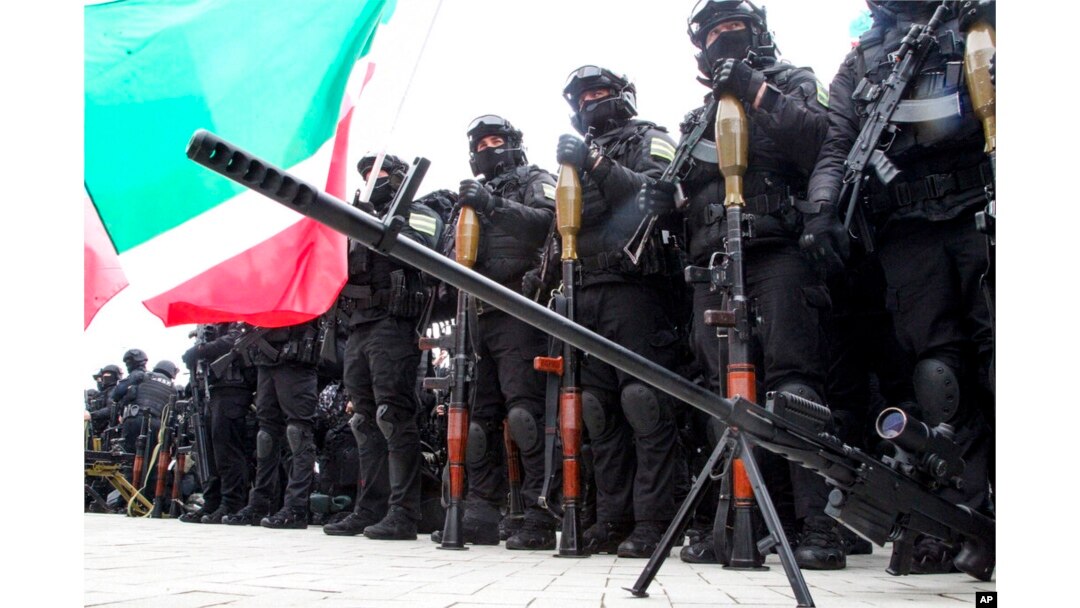Servicemen gather to attend a review of the Chechen Republic's troops and military hardware in Grozny, the capital of the Chechen Republic, Russia, Feb. 25, 2022.