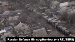 View from a Russian Army aviation helicopter as it escorts units of Russian Armed Forces in Ukraine, during their invasion, at in unspecified location in this screengrab obtained from social media, March 2, 2022.