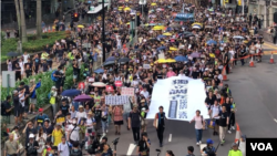 2019年7月21日香港民众为反对可将港人引渡到中国大陆的《逃犯条例》修订案再次举行大游行。(美国之音海彦拍摄)