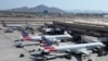 FILE - American Airlines planes sit at their gates at Phoenix Sky Harbor International Airport, in Phoenix, Arizona, July 19, 2024.