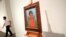 Artist Frida Kahlo's painting 'Nina Con Collar' sits on an easel at Sotheby's auction house in New York, Nov.14, 2016.