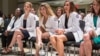 FILE- Austin Community College students who completed the nursing associate degree program participate in a pinning ceremony, May 10, 2017.