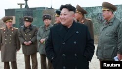 North Korean leader Kim Jong Un supervises at a rocket-launching drill in this undated photo released by the Korean Central News Agency in Pyongyang, Dec. 30, 2014. 