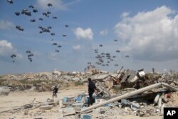 FILE—Humanitarian aid is airdropped to Palestinians over Gaza City, Gaza Strip on March 25, 2024.