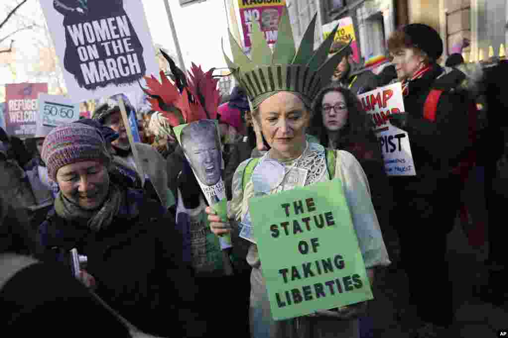 Demonstrators take part in the Women's March on London, following the Inauguration of U.S. President Donald Trump, in London, Jan. 21, 2016.