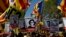 Demonstrators wave esteladas or independence flags in Barcelona, Spain, April 15, 2018, during a protest in support of Catalonian politicians who have been jailed on charges of sedition.