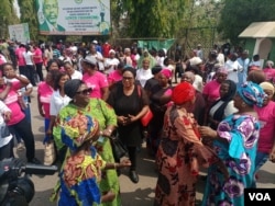 Women dance and sing as they protest to demand better representation of women in parliaments, at Nigeria's National Assembly in Abuja, March 2, 2022. (Timothy Obiezu/VOA)
