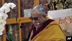 Tibetan spiritual leader the Dalai Lama reacts during a religious talk at the Tsuglakhang temple in Dharmsala, India, March 15, 2011