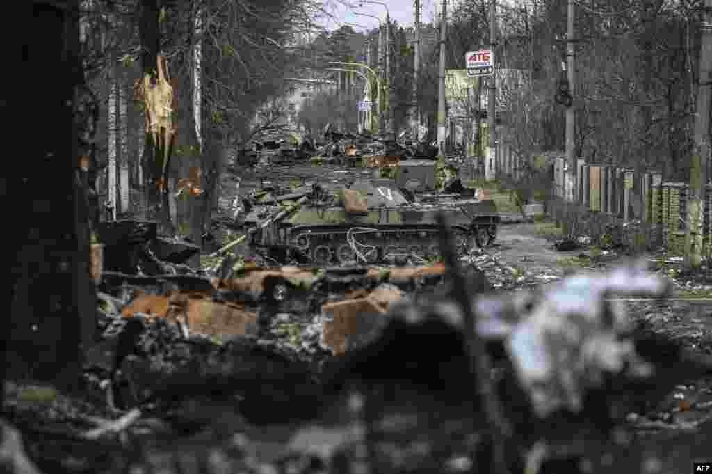 Destroyed Russian armored vehicles litter the street in the city of Bucha, west of Kyiv, Ukraine.