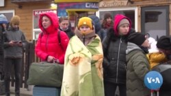 Ukraine’s Women and Children Flee as Men Must Stay to Fight 