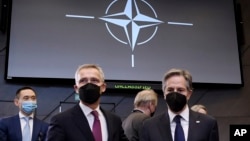 U.S. Secretary of State Antony Blinken, right, poses with NATO Secretary General Jens Stoltenberg during a an extraordinary NATO foreign ministers meeting, at NATO headquarters in Brussels, Belgium, March 4, 2022.