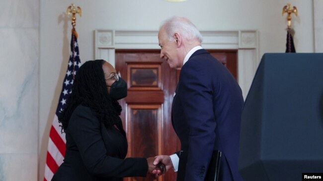 U.S. President Joe Biden shakes hands with U.S. Appeals Court Judge Ketanji Brown Jackson after announcing her as his nominee to be a U.S. Supreme Court Associate Justice, Feb. 25, 2022.