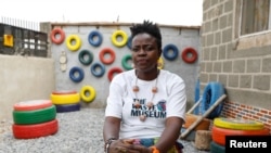 Jumoke Olowookere, founder of the Waste Museum, sits for a photograph after talking with Reuters at the museum in Ibadan, Nigeria on February 23, 2022. (REUTERS/Temilade Adelaja)