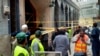 Rescue workers and volunteers gather at the site of bomb explosion in Peshawar, Pakistan, March 4, 2022.