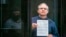 FILE - Paul Whelan, a former U.S. Marine who was arrested for alleged spying, listens to the verdict in a courtroom at the Moscow City Court, in Moscow, Russia, June 15, 2020. (Moscow News Agency photo via AP)