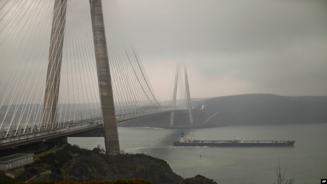 FILE - Oil tanker ship SCF 'Samotlor' sails under Yavuz Sultan Selim bridge as it crosses the Bosphorus strait after departing from Russia's Novorossiysk port, in Istanbul, March 1, 2022.