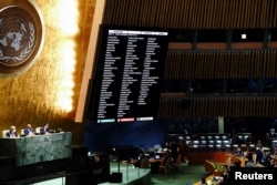FILE - A general view shows the results of the voting during the 11th emergency special session of the U.N. General Assembly on Russia's invasion of Ukraine, at the United Nations Headquarters in Manhattan, New York City, March 2, 2022.