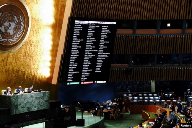 FILE - A general view shows the results of the voting during the 11th emergency special session of the U.N. General Assembly on Russia's invasion of Ukraine, at the United Nations Headquarters in Manhattan, New York City, March 2, 2022.