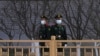 Chinese paramilitary policemen stand guard in the Tiananmen area near the Great Hall of the People ahead of the annual parliamentary meetings on March 3, 2022, in Beijing. 