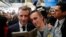 FILE - French President Emmanuel Macron poses for a photo with a worker at the French carmaker Renault factory of Maubeuge, northern France, Nov.8, 2018.