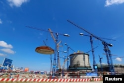 FILE - A dome is installed over a Hualong One nuclear power unit at Fangchenggang nuclear power plant in Guangxi Zhuang Autonomous Region, China, May 23, 2018. (Photo provided by Fangchenggang nuclear power plant and released by China Daily via Reuters)