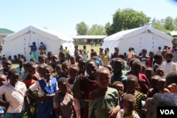 FILE - Children gather at a camp in the Phalombe district, Malawi, Feb. 3, 2022. Health experts say the COVID-19 pandemic has deprived many children of the chance to complete all doses of the polio vaccine. (Lameck Masina/VOA)