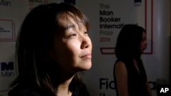 FILE - Han Kang speaks to the media after winning the Man Booker International prize for fiction for her book 'The Vegetarian' in London, Tuesday, May, 16, 2016. Kang has won the Nobel Prize for Literature. (AP Photo/Alastair Grant, File)