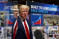 President Donald Trump speaks as he tours Ford's Rawsonville Components Plant that has been converted to making personal protection and medical equipment, in Ypsilanti, Mich., May 21, 2020.