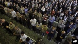 Iranian worshippers perform their Eid al-Adha prayers at Tehran University campus in Tehran, Iran. Even Shi’ite clergy who do not share the government’s views -- are being targeted by authorities.