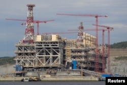 FILE - A concrete structure that is part of Russia's Arctic LNG 2 project is seen under construction in a dry dock near the settlement of Belokamenka, Murmansk region, Russia, on July 26, 2022.