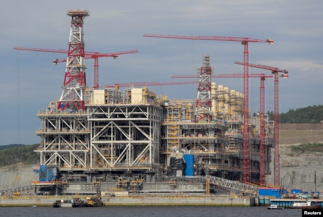FILE - A concrete structure that is part of Russia's Arctic LNG 2 project is seen under construction in a dry dock near the settlement of Belokamenka, Murmansk region, Russia, on July 26, 2022.