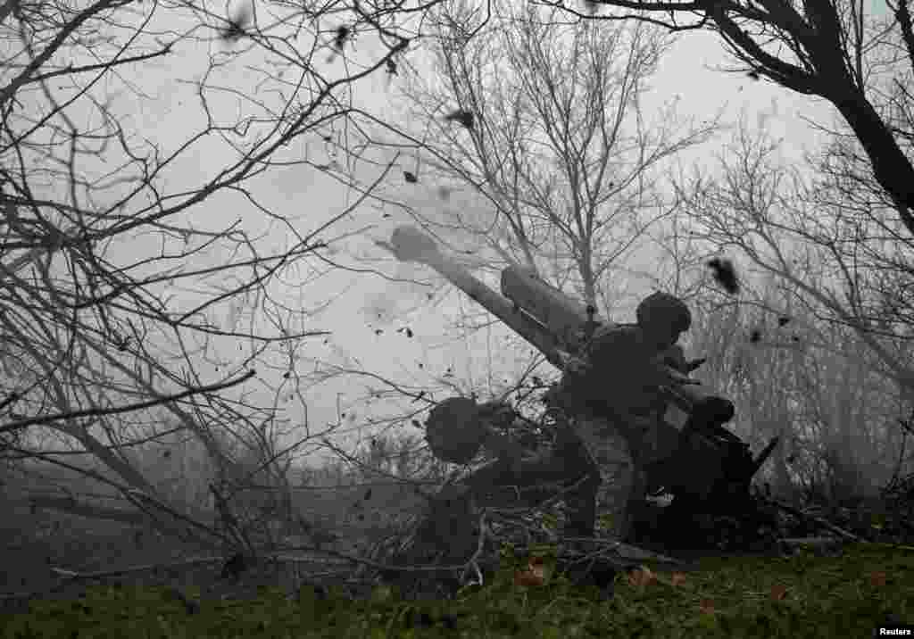 A serviceman of the artillery crew of the special unit National Police fires a D-30 howitzer towards Russian troops at a position in a front line, amid Russia's attack on Ukraine, in Zaporizhzhia region, Ukraine, Jan. 11, 2025.