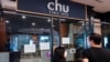 People look inside Chu Chocolate Bar & Cafe days after it permanently closed due to business lost as a result of coronavirus restrictions, in Bangkok, Thailand, June 1, 2021.